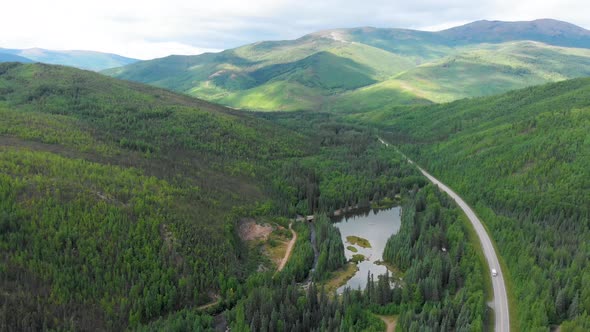 4K Drone Video (4X speed truck shot) of Mountains along Chena Hot Springs Road near Entrance of Reso