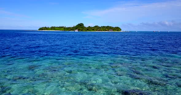 Wide angle flying abstract view of a sandy white paradise beach and blue water background in best qu