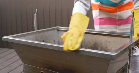 Cleaning of barbecue oven at outdoor