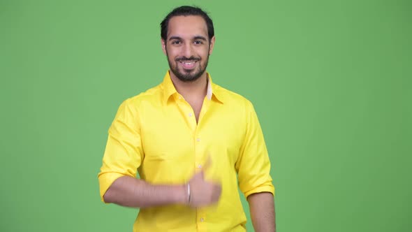 Young Happy Bearded Indian Businessman Giving Thumbs Up