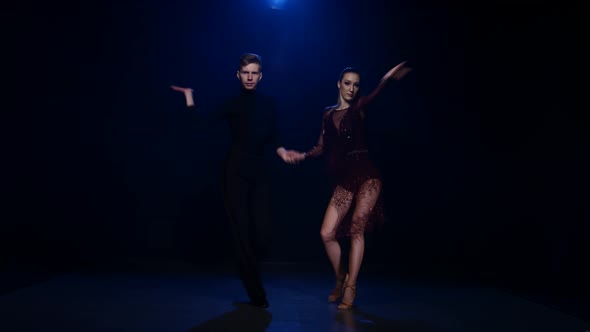 Contemporary Dancing Pair of Professional Elegant Dancers in Smoky Studio