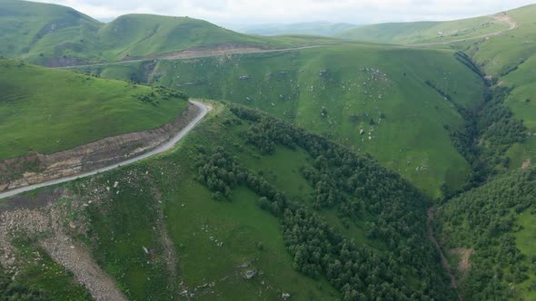 View of the Green Caucasus Mountains in Summer From the Sky