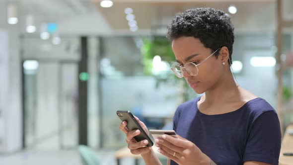 Portrait of Online Payment Loss on Smartphone By African Woman 