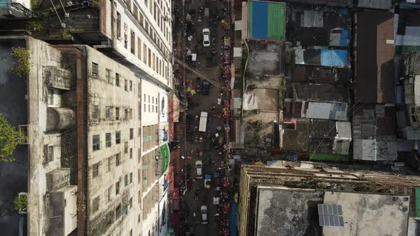 Aerial Top Down Rooftop View Of Busy Downtown Street In Mumbai. Dolly Forward