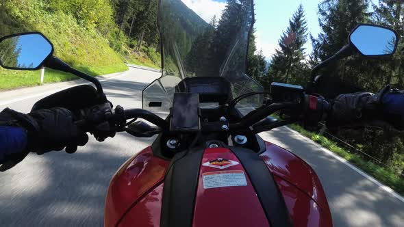 POV Biker Rides on Motorbike By Scenic Green Mountain Road Swiss Alp Moto Trip