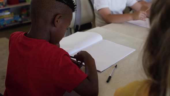 Group of kids studying in the class