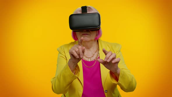 Senior Woman Using Virtual Reality VR App Headset Helmet to Play Simulation 3D Video Game Drawing