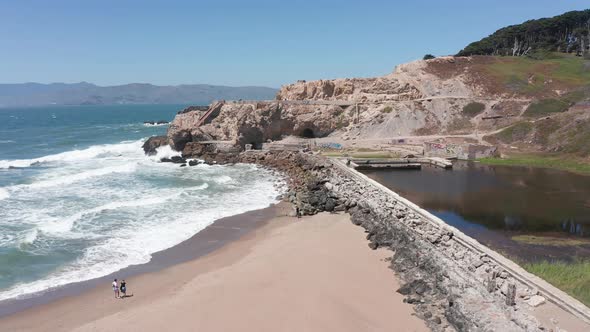 Low close-up aerial shot of the ruins of the Sutro Baths at Land's End in San Francisco. 4K