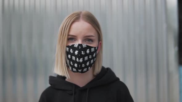 Eyes Behind Face Mask. Portrait of Young Female Looking At Camera, Close Up Slow Motion. Covid-19 Vi