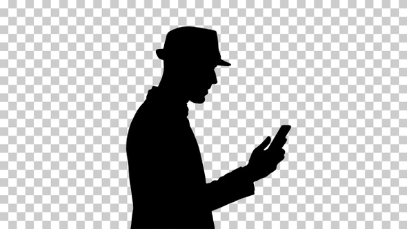 Silhouette Man walking with a phone and serfing internet