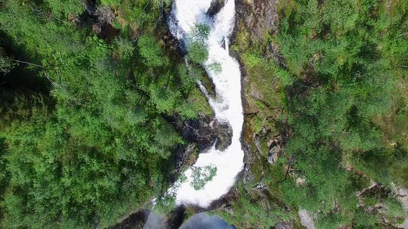 Flying above Voringfossen waterfall in Norway, popular tourist attraction.