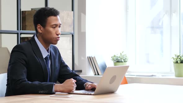 Video Chat on Laptop by Businessman