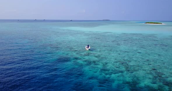 Luxury above abstract view of a white sand paradise beach and aqua blue water background 