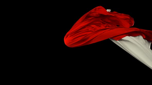 White and red fabric flowing on black background, Slow Motion