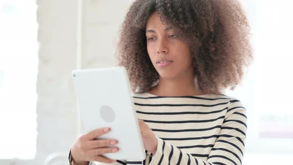 African Woman Using Digital Tablet