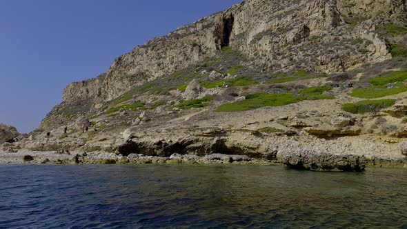 Levanzo island and small hidden beach with crystal sea water in Sicily, Italy. Slow-motion