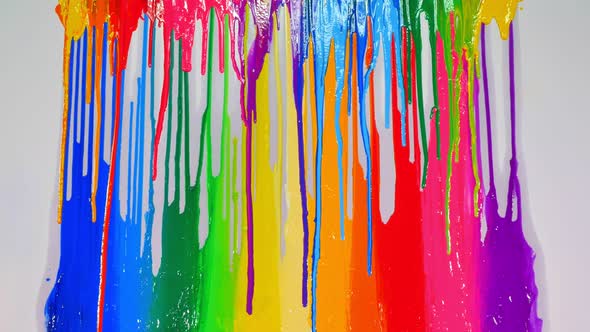 Various Colors Are Dripping On Rainbow Paint