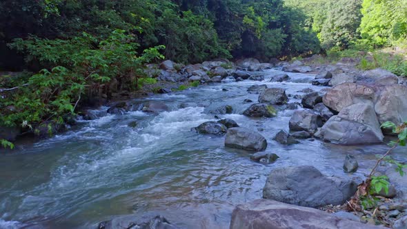 Flying Over Water Flowing At Rocky Rio Higuero In The Dominican Republic. - aerial