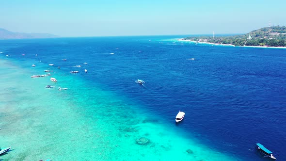 Natural aerial island view of a sunshine white sandy paradise beach and aqua blue ocean background i