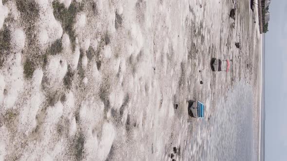 Vertical Video of Low Tide in the Ocean Near the Coast of Zanzibar Tanzania Aerial View