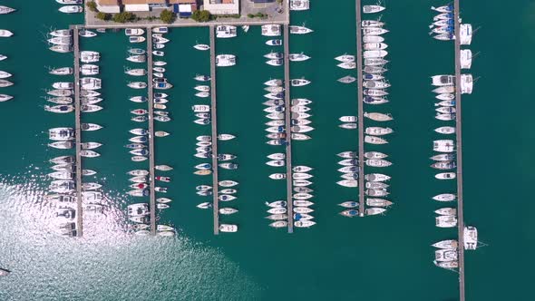 Bird eye view from drone of yachts and sailboats in the harbor marina.