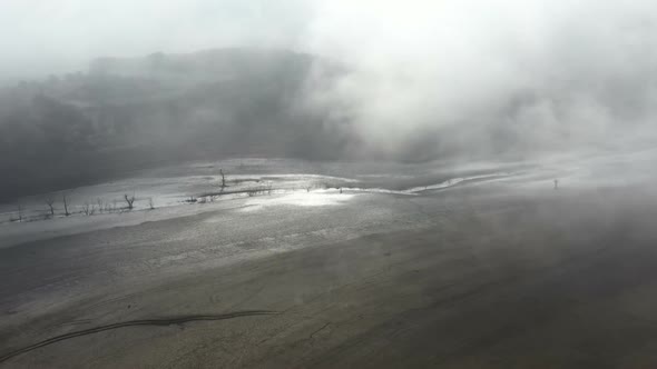 Flight Over A Dry Dam In The Autumn Foggy Day In The Morning 