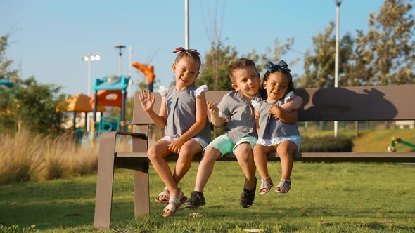 Funny happy children siblings playing in the park