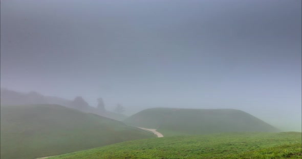 Fog Moving Over the Mounds in Kernave, Lithuania