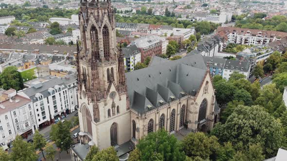 Drone pan revealing the surrounding area around the Great Saint Martin Church in Cologne, Germany 4K