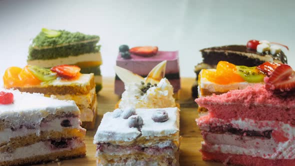 Pieces of Different Cakes on a Retrostyle Baking Tray