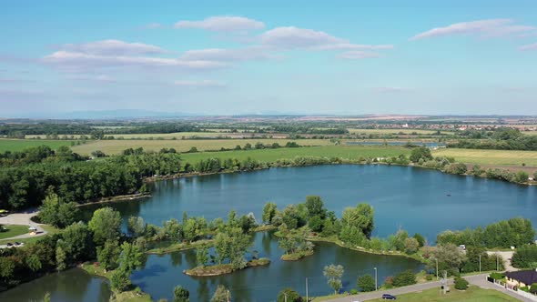 Aerial view of a natural swimming pool in the town of Surany in Slovakia