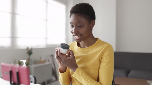 Joyful Millennial African Woman Recording Video Blog on Mobile Phone