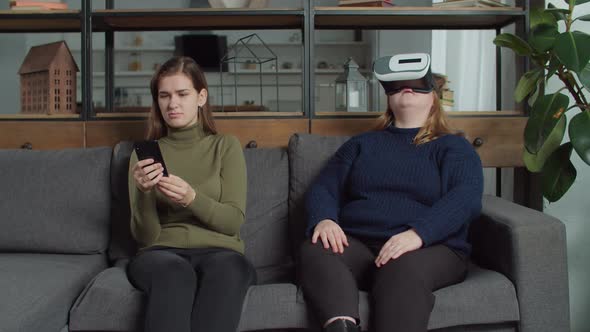 Woman in Vr Headset Scaring Deaf Female Friend