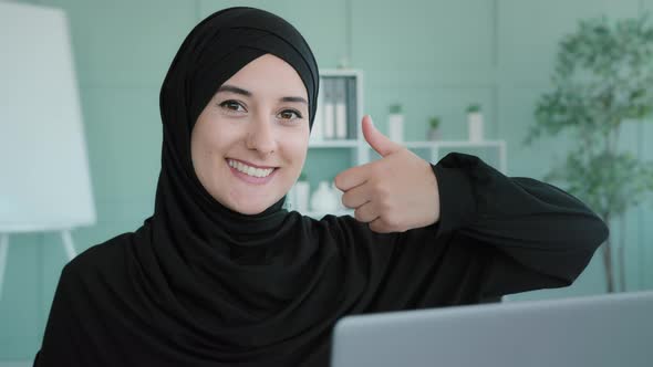 Arabian Islamic Muslim Student in Black Hijab Successful Businesswoman Sitting at Workplace Home