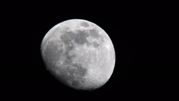 Detail View Of Last Quarter Moon Moving In The Darkness Of Night. - close up