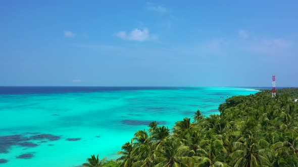 Tropical overhead abstract view of a white sandy paradise beach and aqua blue water background in co