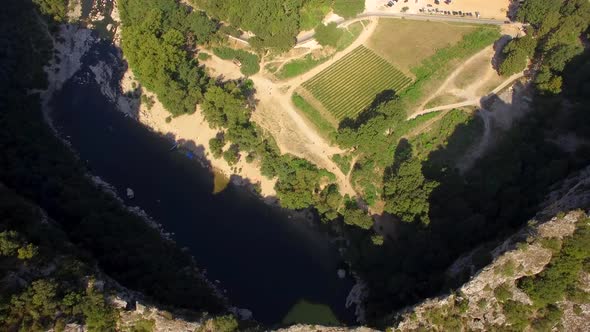 Aerial travel drone view of the Pont d Arc natural arch and river, Southern France.