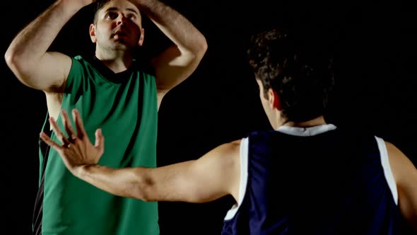 Competitors playing basketball in the court 4k