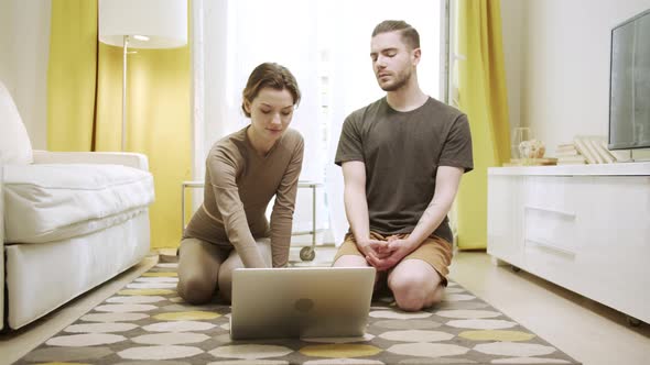 A Sporty Couple is Starting to Meditate and Relax