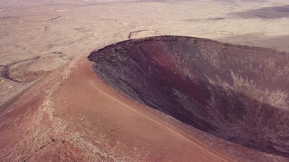 Panning Lajares' volcano's crater with a drone in Fuerteventura, Canary Islands, Spain