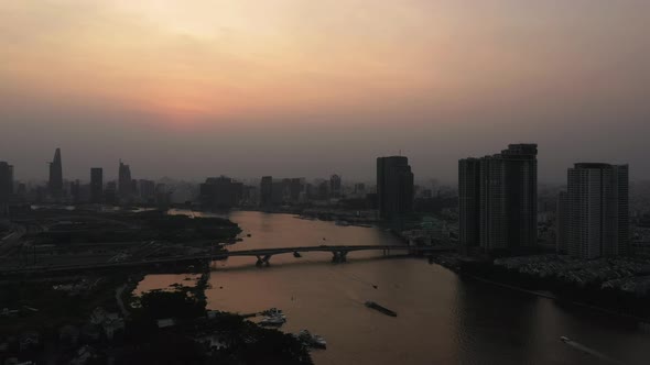 Drone shot of Saigon river smoggy sunset typical of a day with an extreme air pollution reading in S