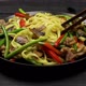 Stir Fried Noodles with Garlic Sprouts and Mushrooms on the Plate - VideoHive Item for Sale