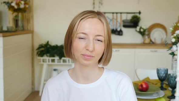 Portrait of Young Smiling Confident Woman or Teenage Girl in Braces on Teeth Wearing White Tshirt