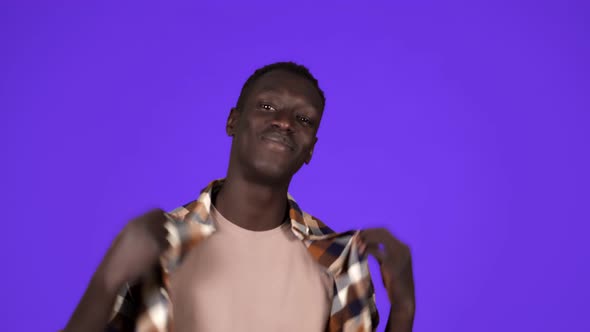 Happy Smiling African American Man in Good Mood on Blue Background