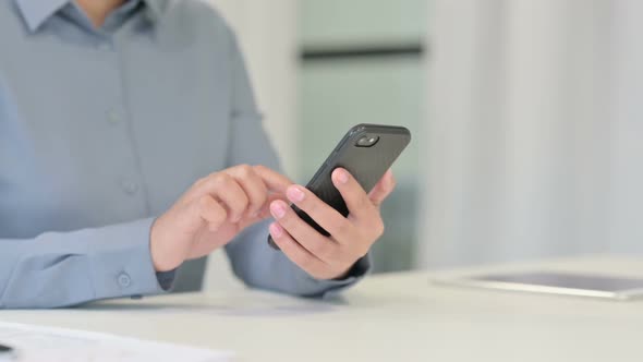 Close Up of African Woman Using Smartphone Mobile