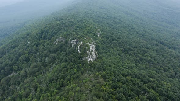 An aerial shot (counter-clockwise orbit) of Big Schloss and Great North Mountain in the evening in t