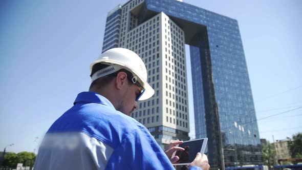 Portrait of a Successful Young Handsome Engineer, Architect, Builder, Businessman, Wearing a White