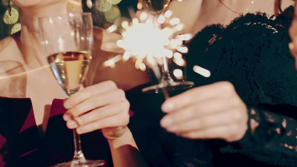 Close Up Portrait of Friends at Party Celebrating Birthday Drinking Champagne or Sparkling Wine