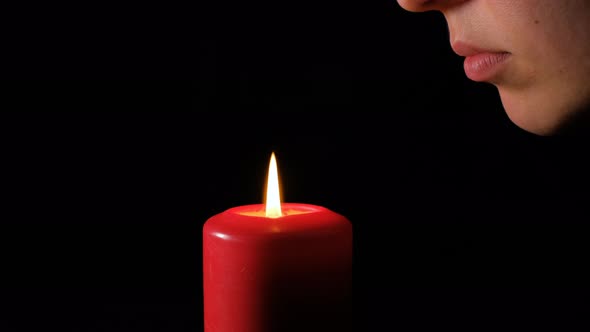 Mouth Blowing Out Red Candle Closeup Macro Slow Motion