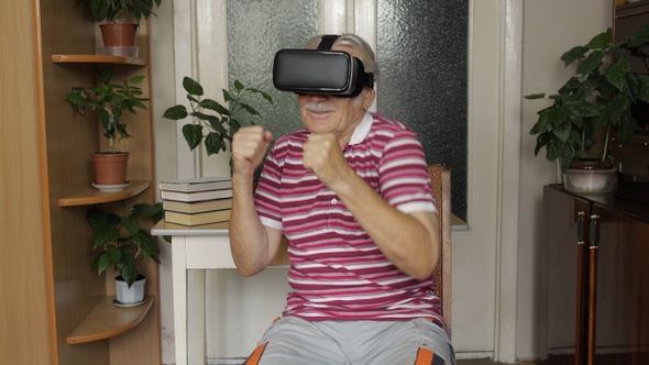 Senior Grandfather in Virtual Headset Glasses Watching Video in 3D Vr Helmet and Dancing, Having Fun